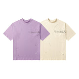 Distressed ripped tee with unique pocket detailing and a mock neck
